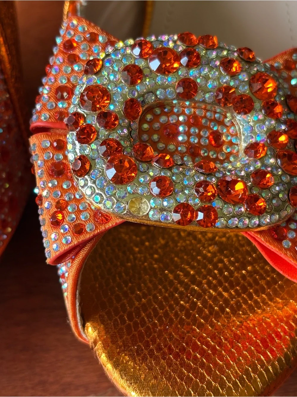 Venus Chan slingback heels w vibrant crystal-encrusted ornament on the peep toe.